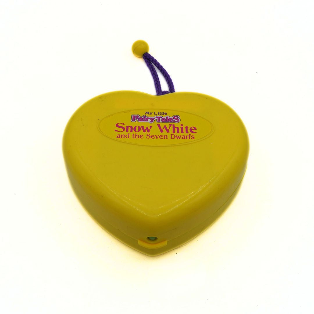 Heart-shaped yellow toy with 'Snow White and the Seven Dwarfs' text on a white background