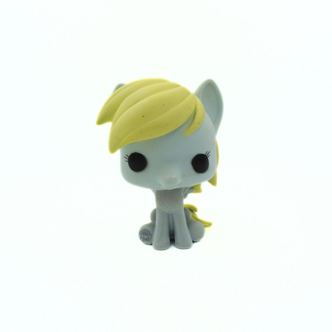 Toy figure with blonde hair and gray body on a white background
