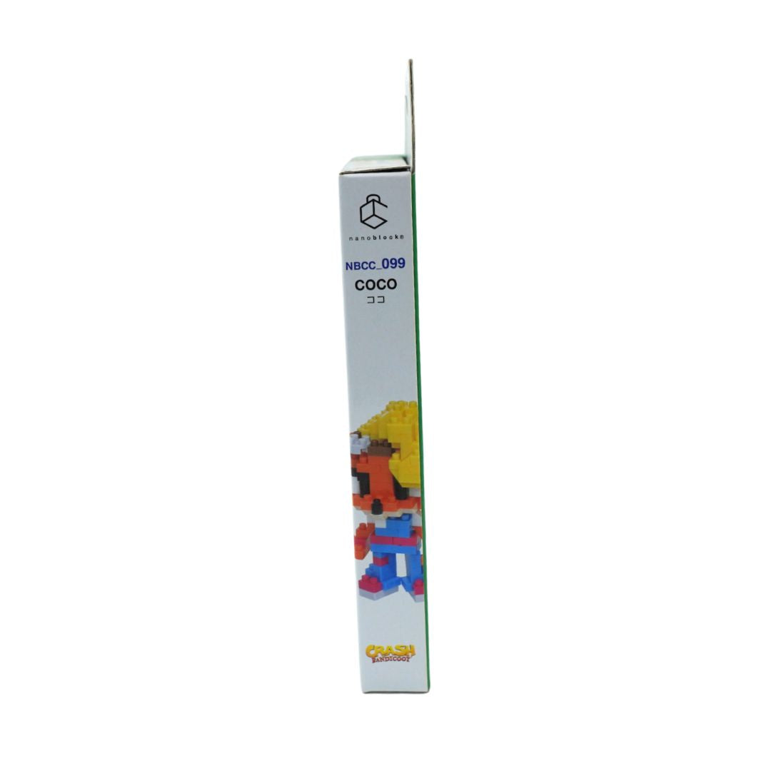 A tall, narrow product box shown upright against a plain white background. The box is predominantly white with blue text reading 'NBCC-099 COCO' and a small colorful character illustration near the bottom.