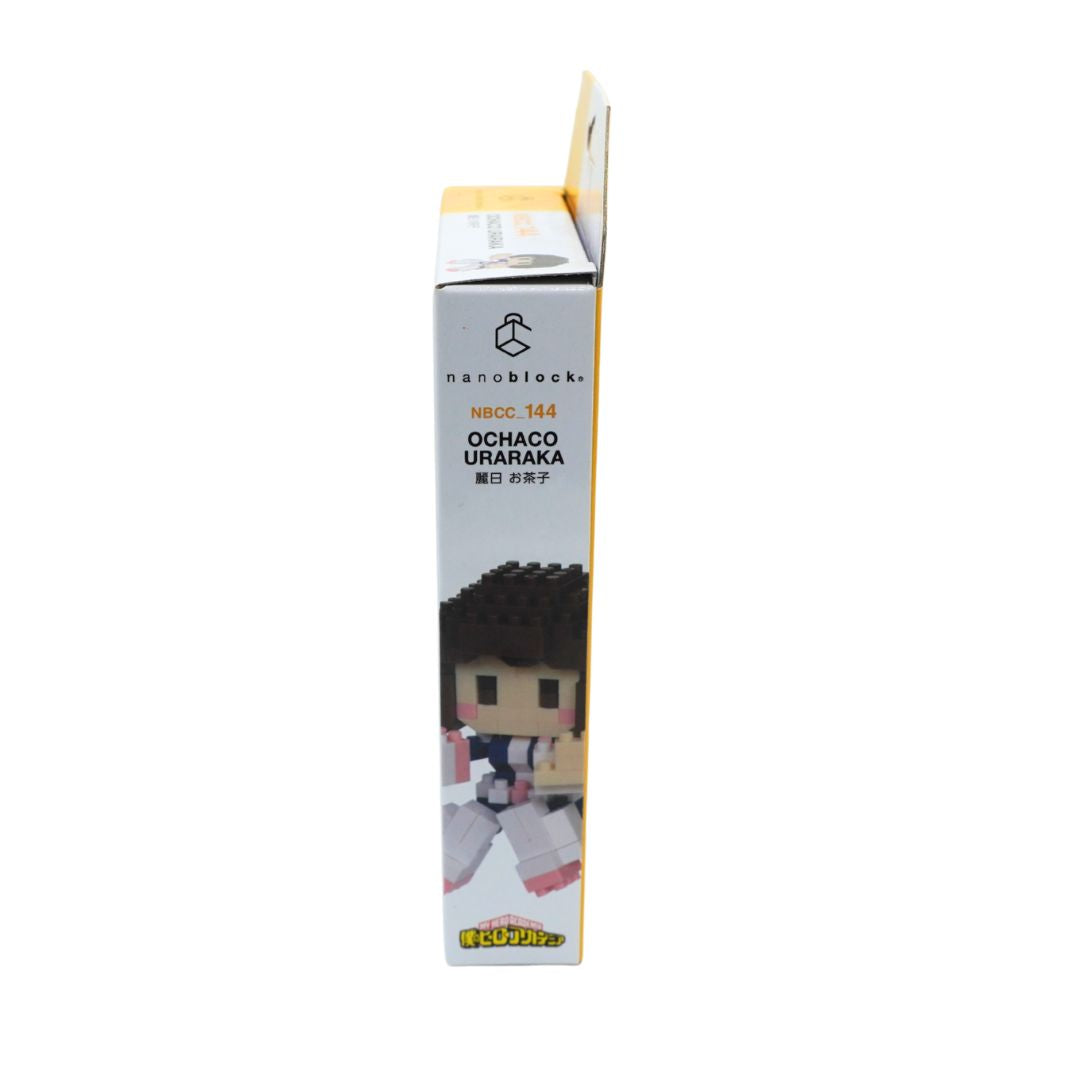 A boxed micro-block figurine package standing upright on a plain white background. The box is mostly white with black text reading 'nanoblocks' and 'OCHACO URARAKA,' plus a small printed illustration of the character on the lower front.