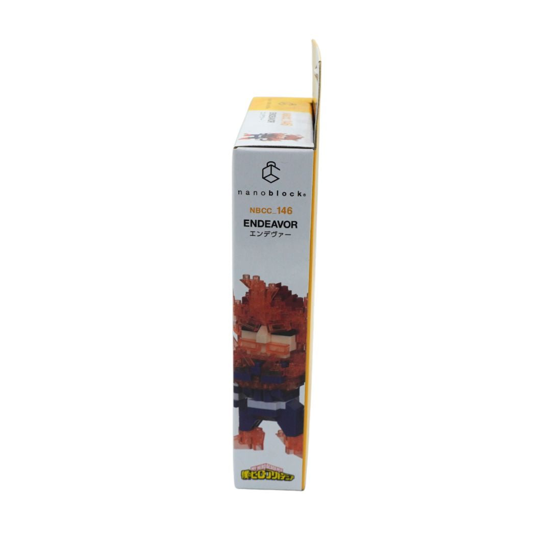 A boxed collectible figure package shown upright against a plain white background. The box is mostly white with a printed illustration of a blocky-haired character in orange, brown, and dark blue tones, plus visible text including 'nanoblocks', 'nbcc_146', and 'ENDEAVOR'.
