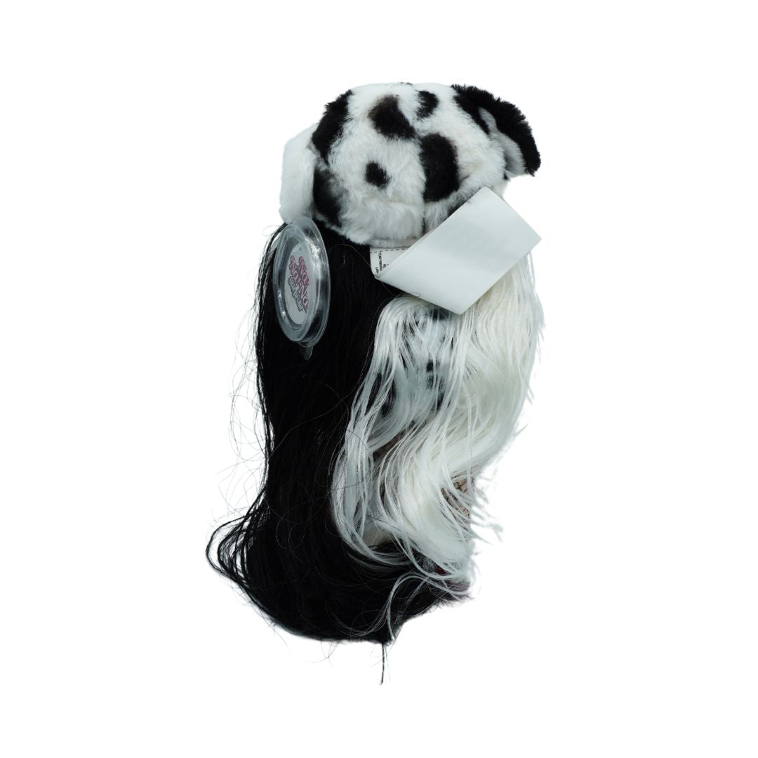A black and white dog-themed wig with a black-and-white spotted faux fur hat, long black and white synthetic hair, and a white ribbon bow, shown against a plain white background.
