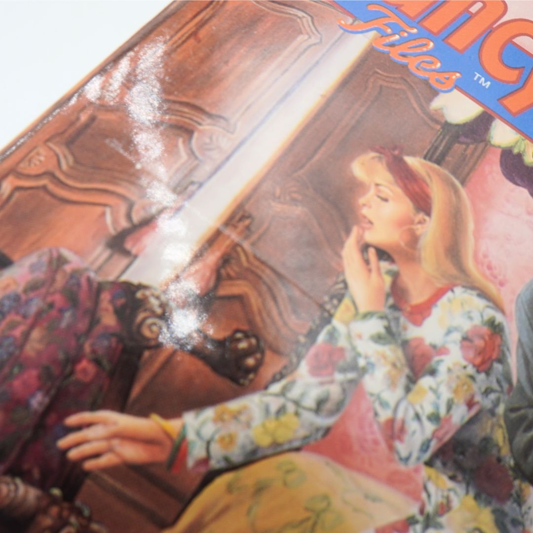 Vintage book cover with a woman and man in a romantic pose, featuring the title 'Mystery Files'.