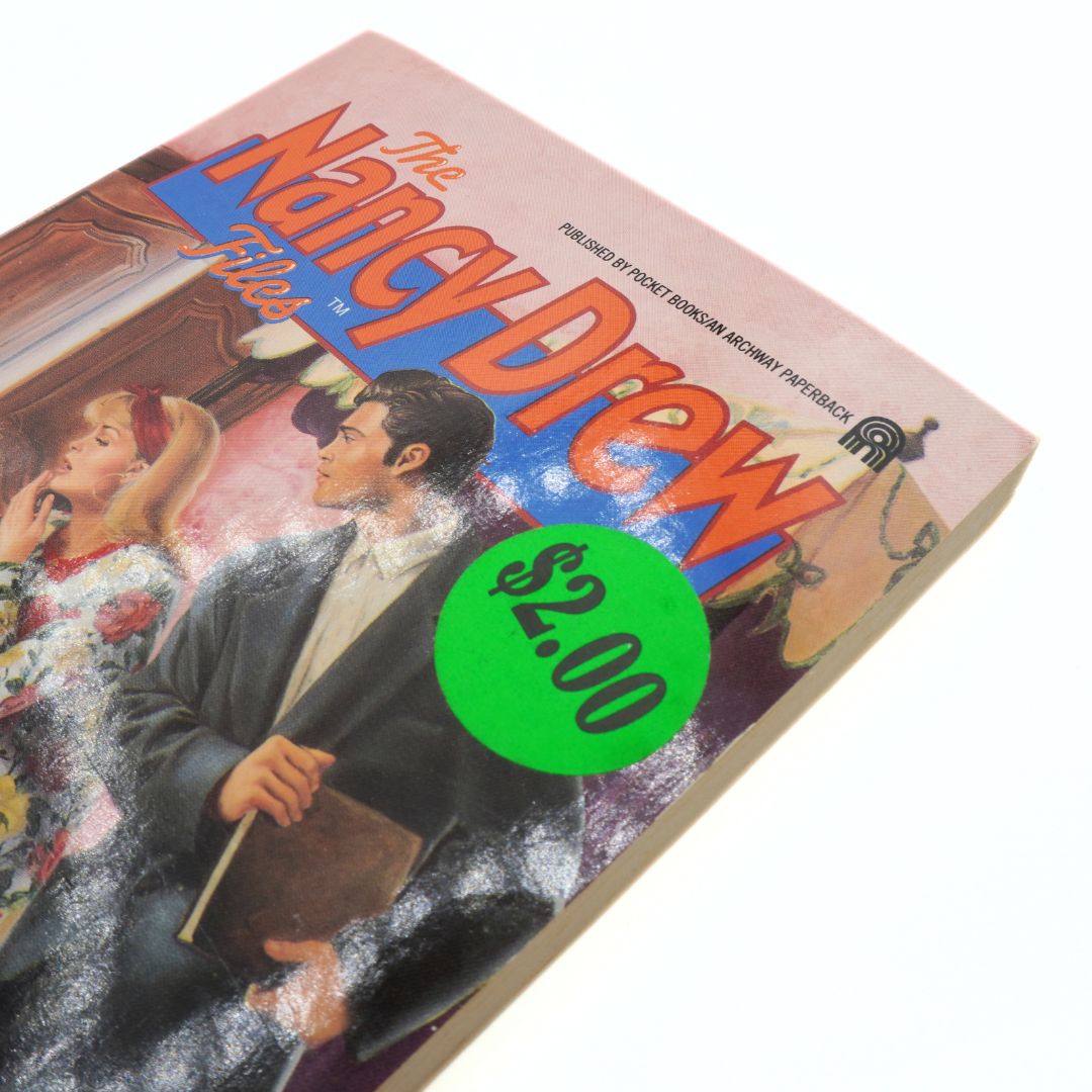 Vintage Nancy Drew book with a green price tag on a white background