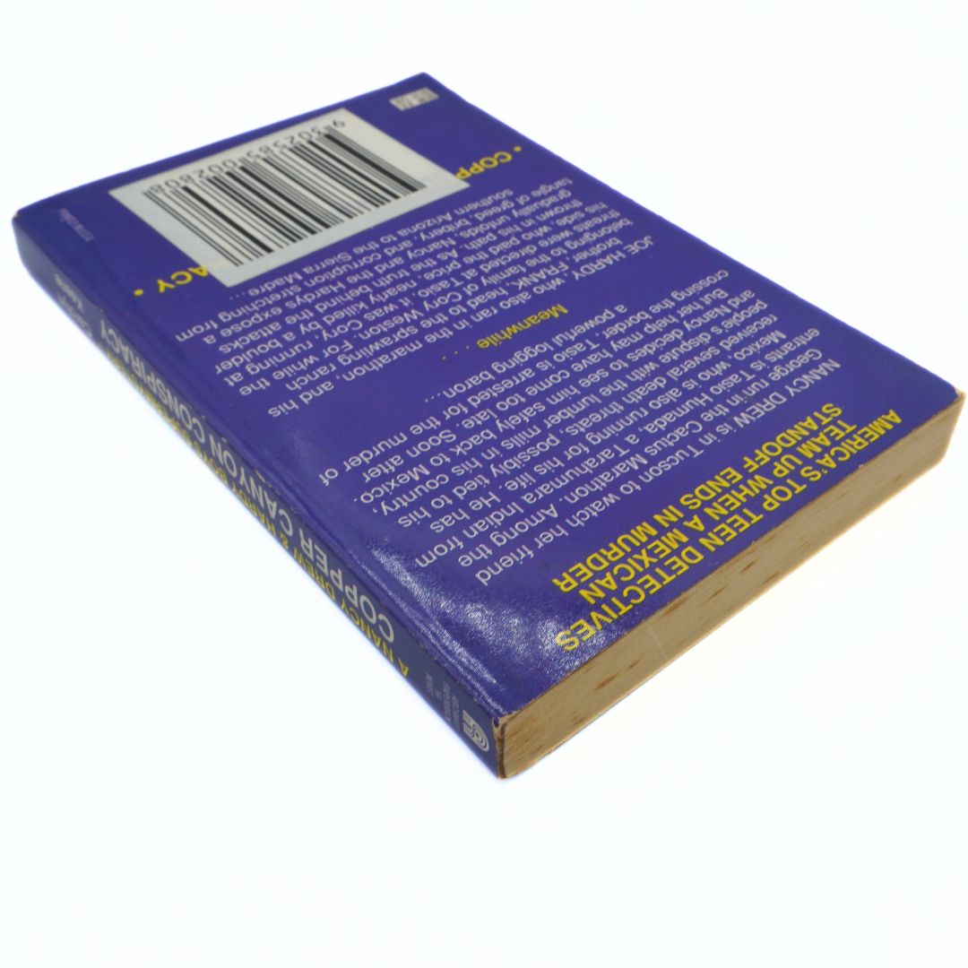 Back cover of a book with text and a barcode on a white background
