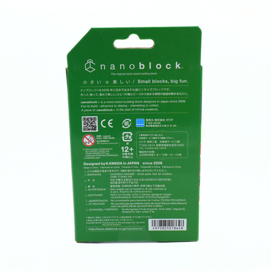 The back of a green Nanoblock toy packaging box, featuring product information, safety certifications, and a barcode on a white background.