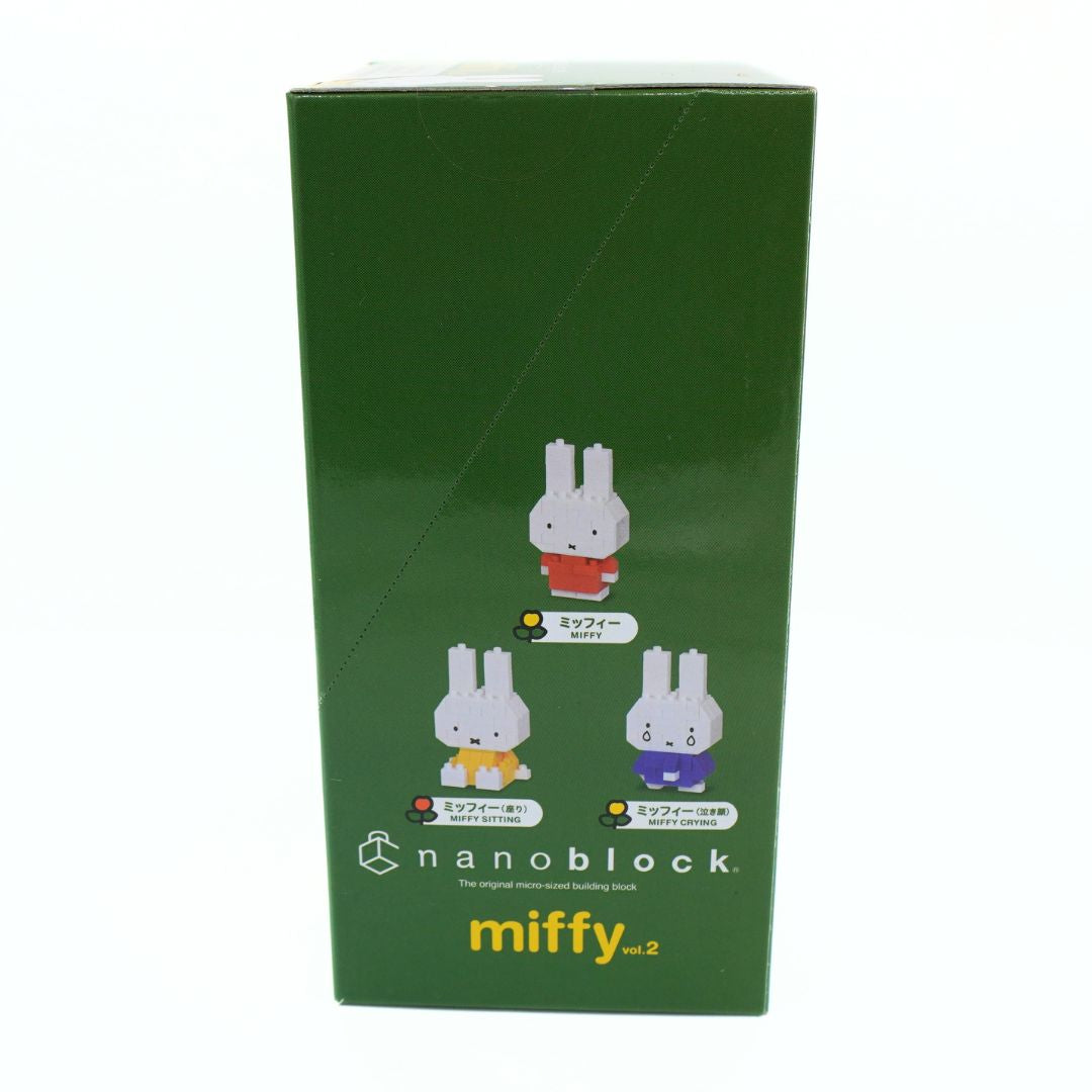 A green Nanoblock miffy™2 collectible figure box featuring illustrations of three Miffy figures in different colored outfits.