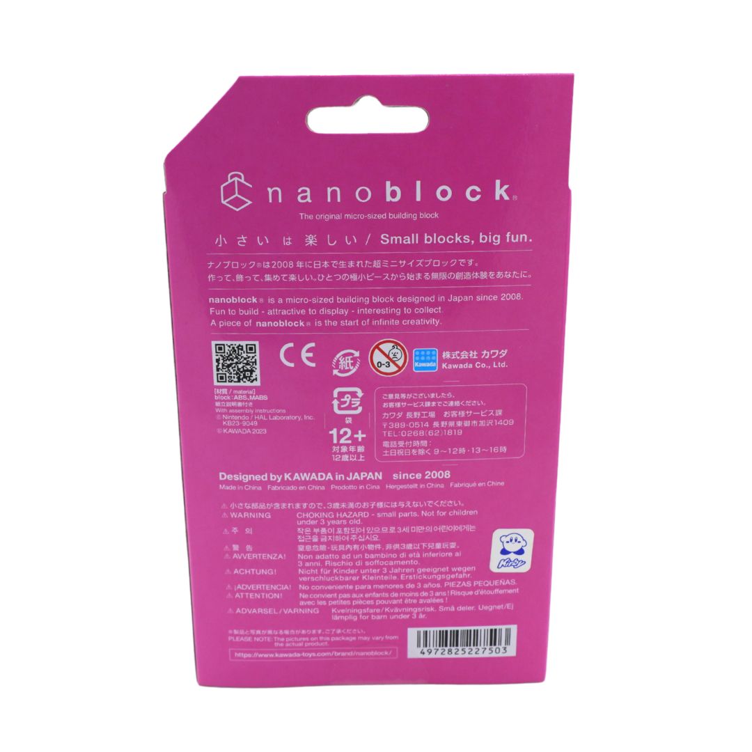 The back of a bright pink Nanoblock toy packaging card, featuring product information, safety icons, a QR code, and a barcode on a plain white background.