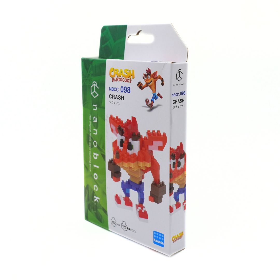 A boxed Crash Bandicoot toy set by NanoBlock, featuring a white and green retail package with printed artwork of Crash and the NamcoBlock logo, photographed on a plain white background.