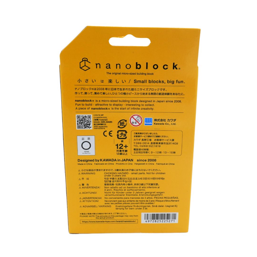 The back of a yellow Nanoblock packaging card, featuring product information, safety icons, and text in English and Japanese on a white background.