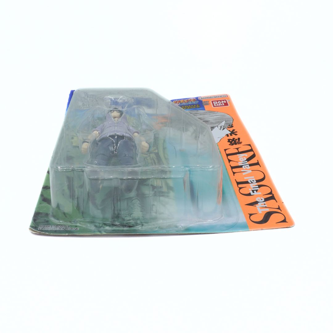 Toy figure in a clear dome packaging with a visible brand label on a white background