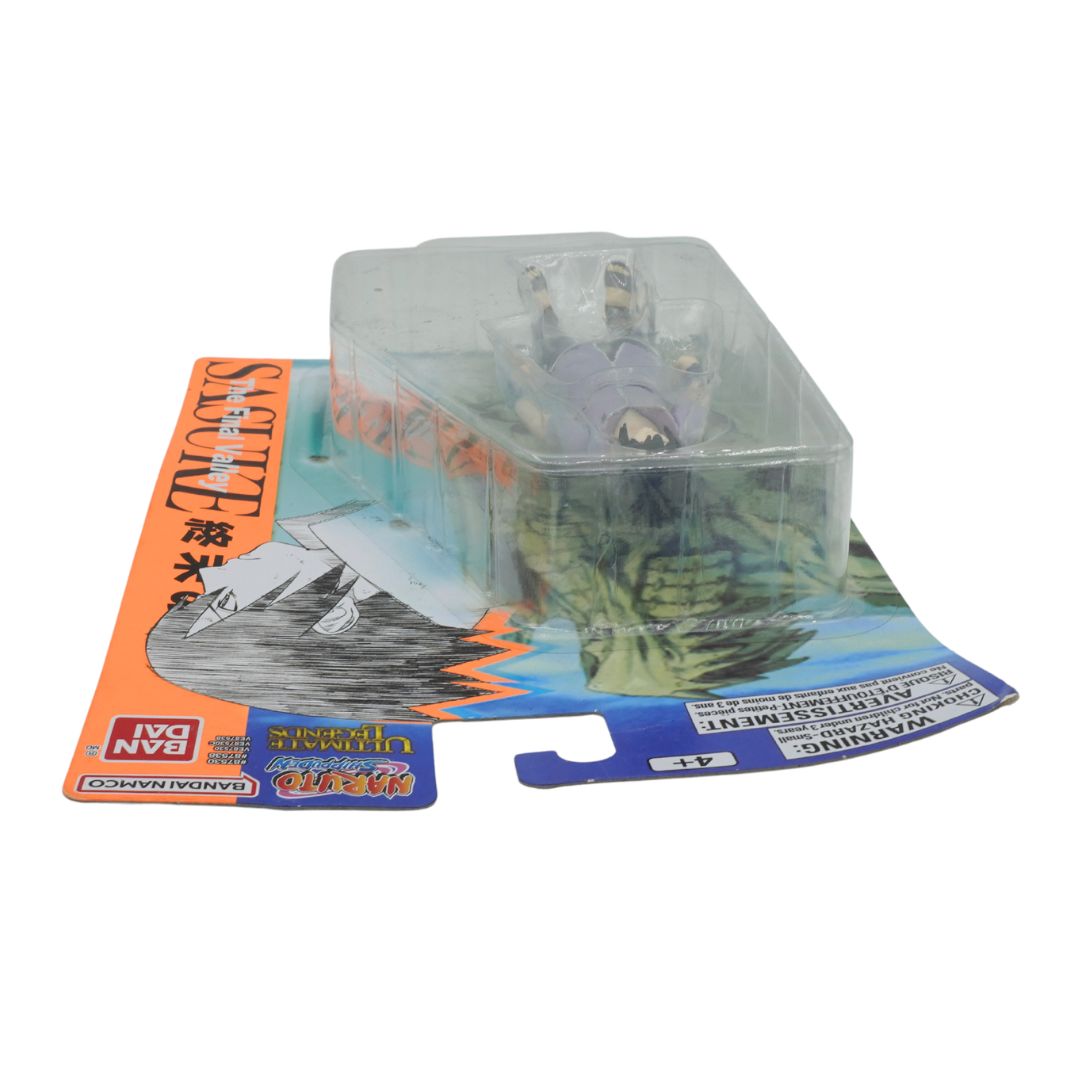 Transparent figurine in packaging with a colorful label on a white background