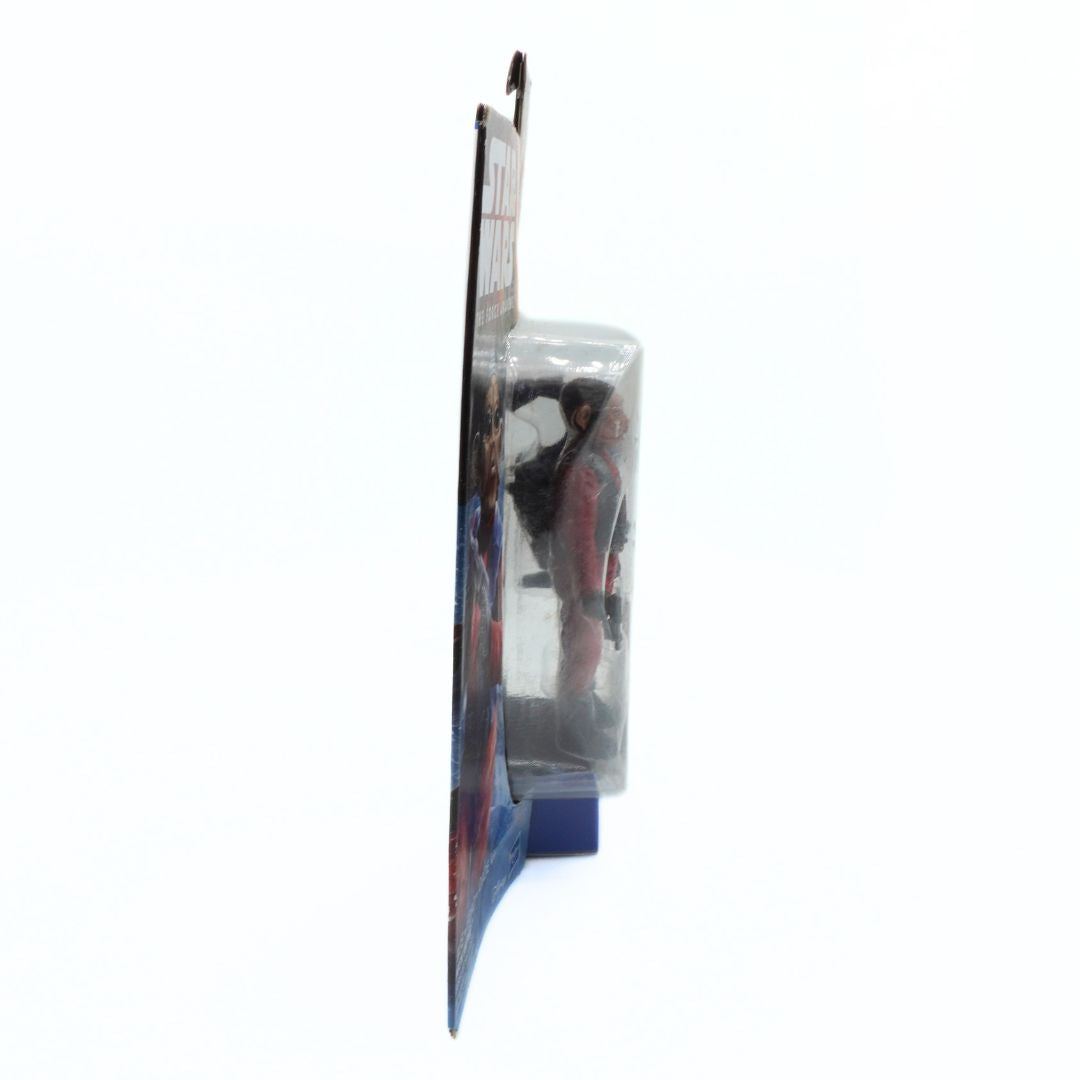 Side on photo of a Star Wars action figure in packaging