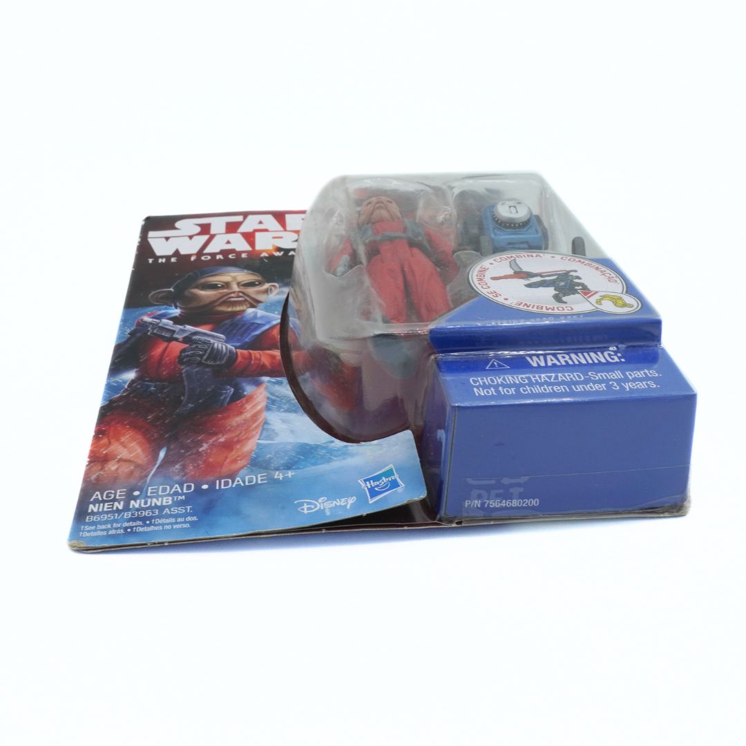 Star Wars toy figure in packaging with warning label on a white background