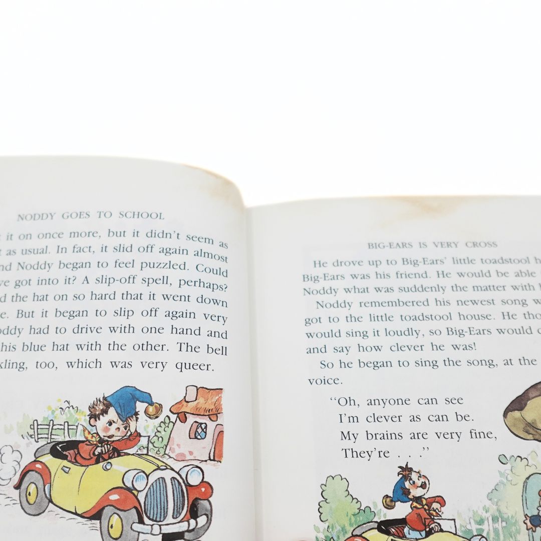 Marks on the top of the pages from a 1990 hardcover edition of Noddy Goes to School