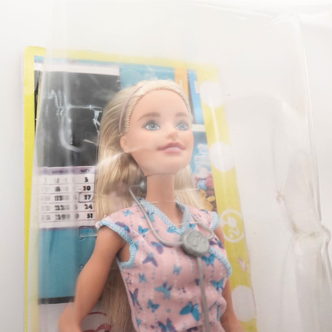 Close up of a 2017 Nurse Barbie in packaging showing some damage to the box