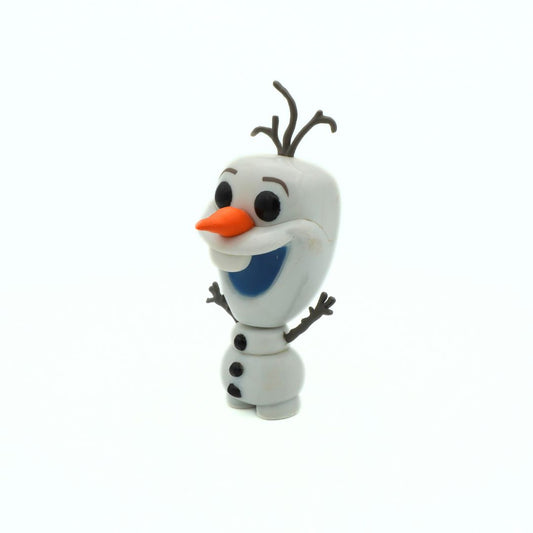 Toy figure of a snowman with a carrot nose and black buttons on a white background