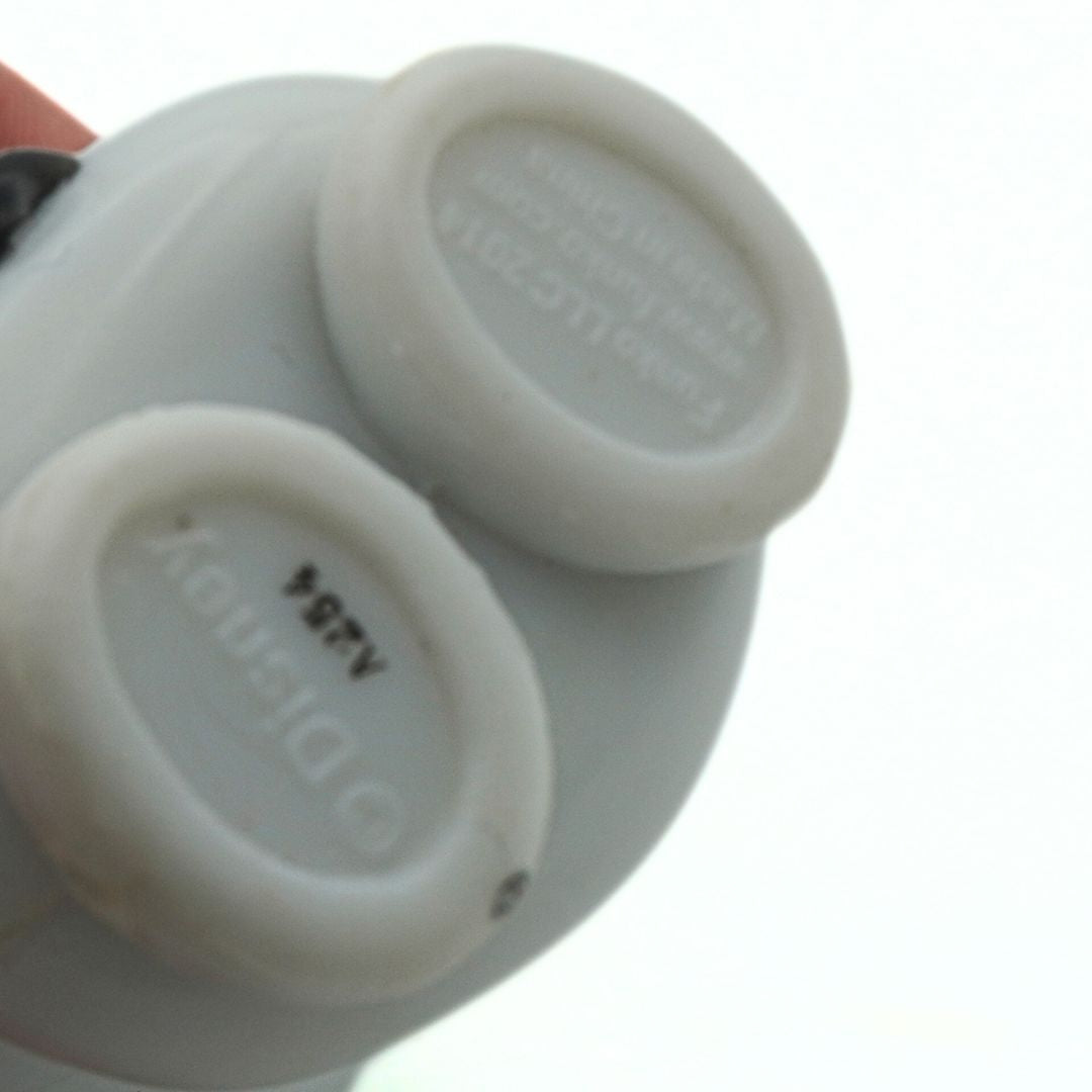 Underside of a 2014 Olaf Funko Pop showing branding information on a white background