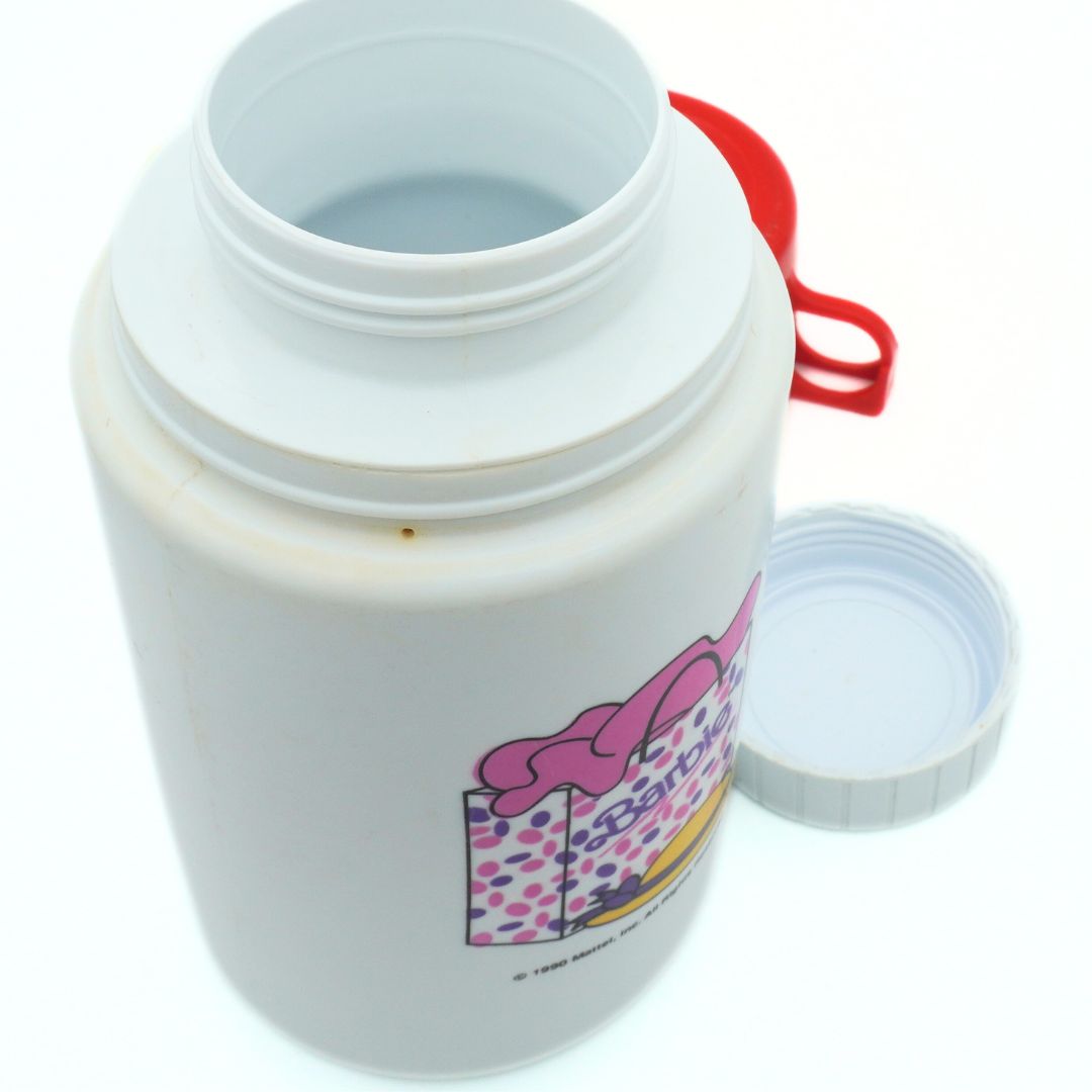Barbie Thermos released in 1990 with the lid off, showing some minor discolouration and the pink bag decal