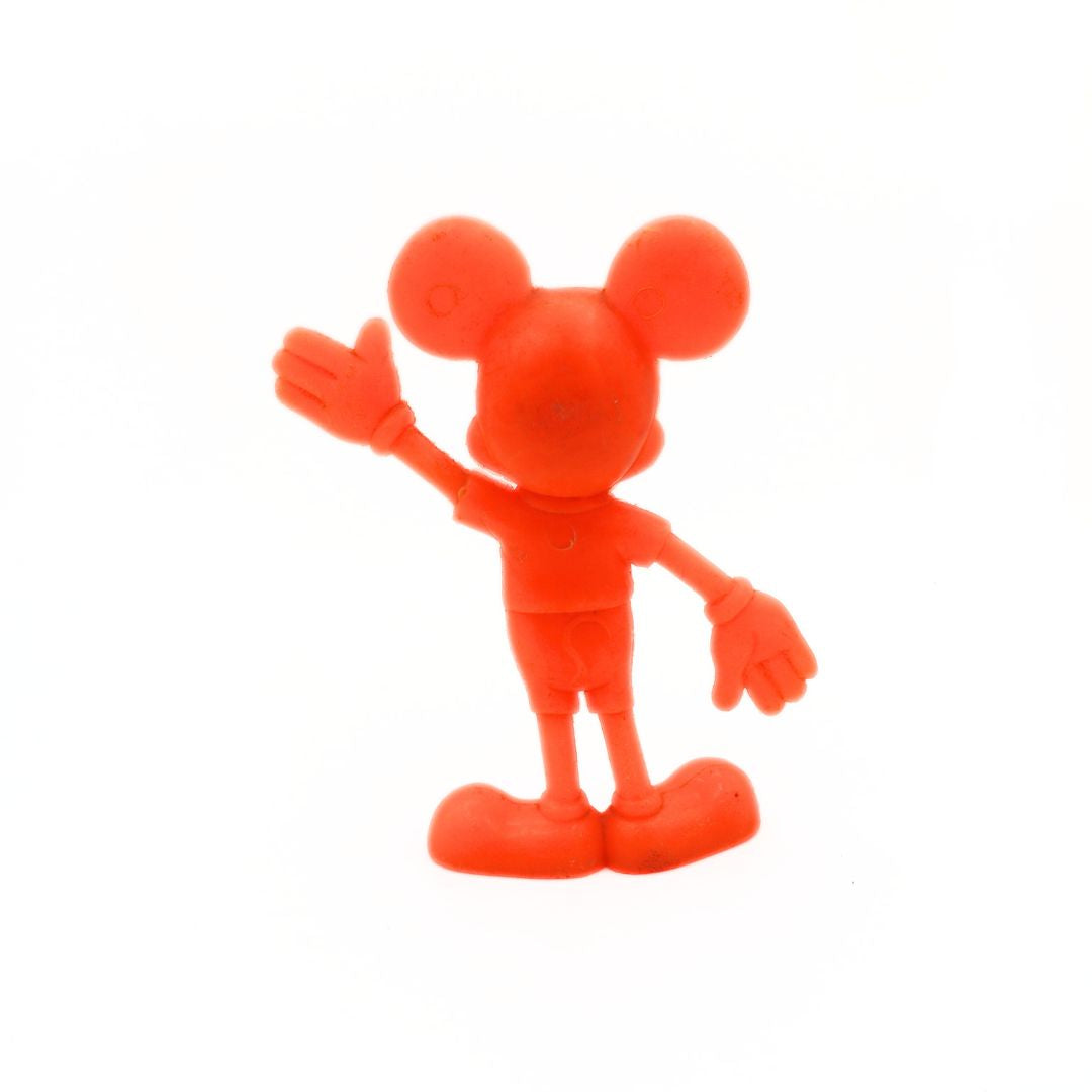 Red cartoon character figurine on a white background