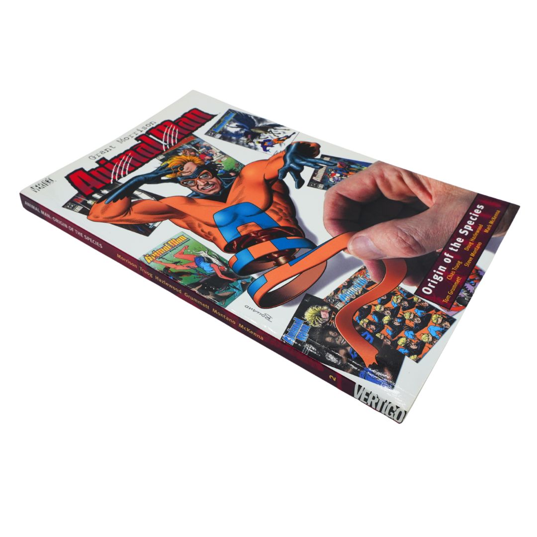 A hardcover book titled 'Origins of the Species' published by Vertigo Comics, featuring a dynamic comic book cover with an orange and blue superhero on a white background.