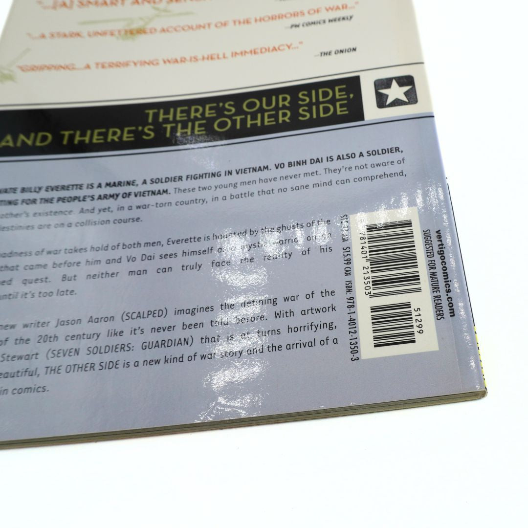 Barcode on a grey and cream book, photographed on a white background