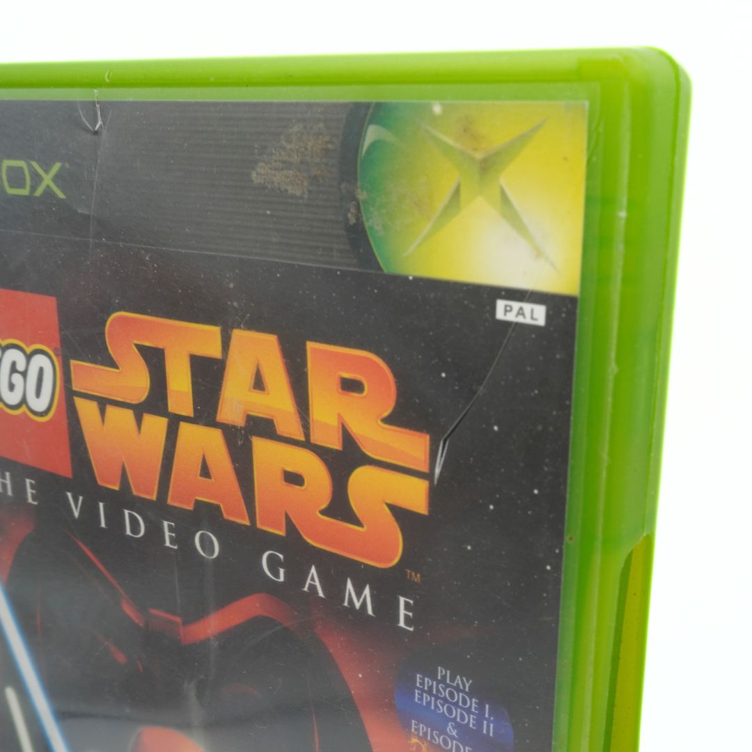 Close-up of a LEGO Star Wars video game case with green border