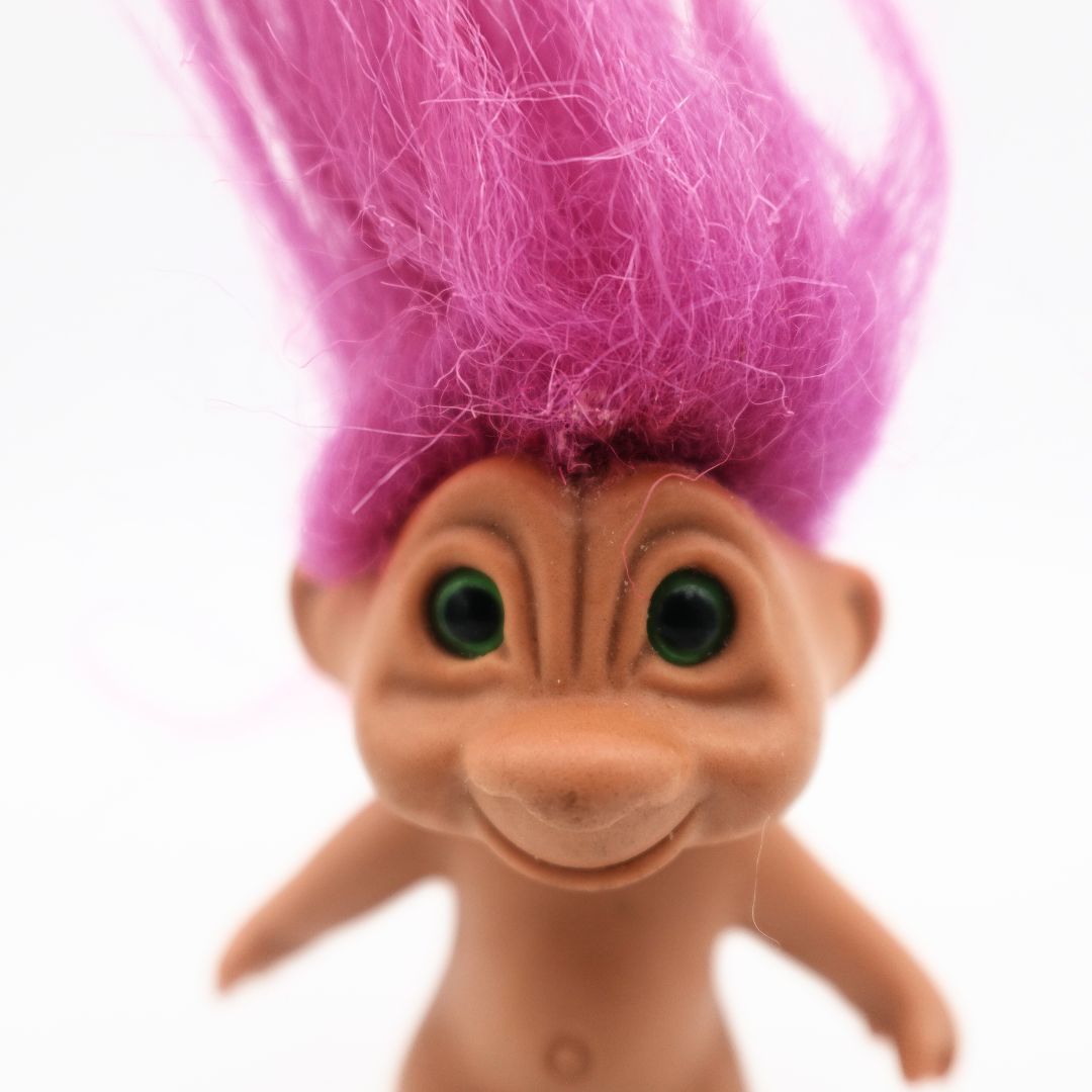 Green eyes and pink hair troll doll