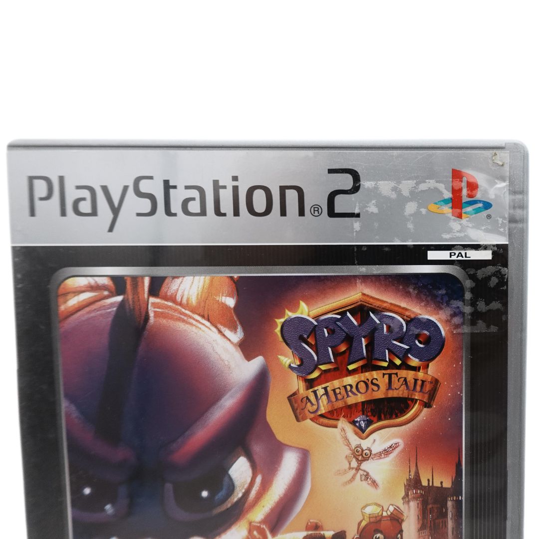 Photo of the top corner from the PS2 Spyro A Hero's Tail game showing sticker residue