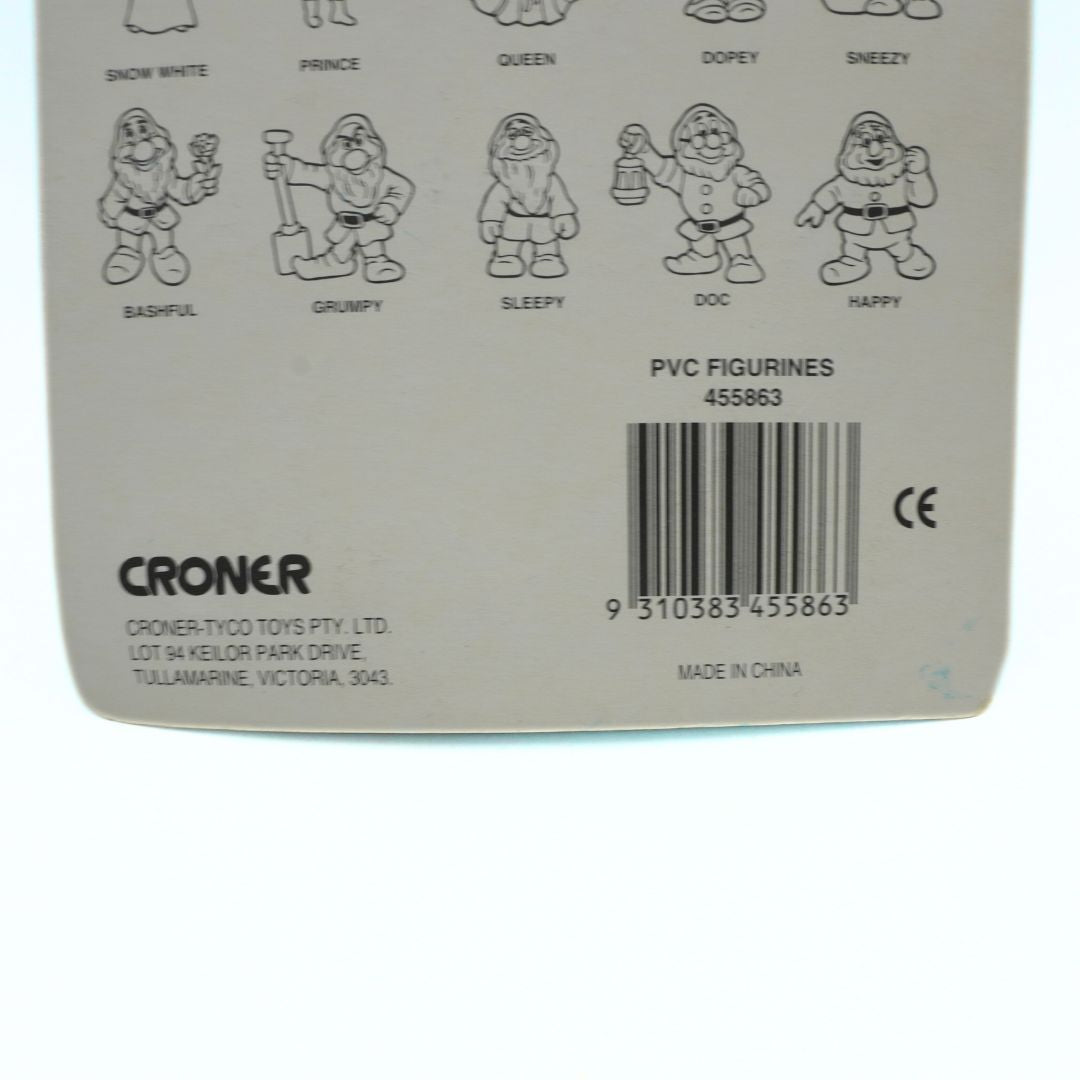Back of a box with cartoon characters and product details, including a barcode and brand name.
