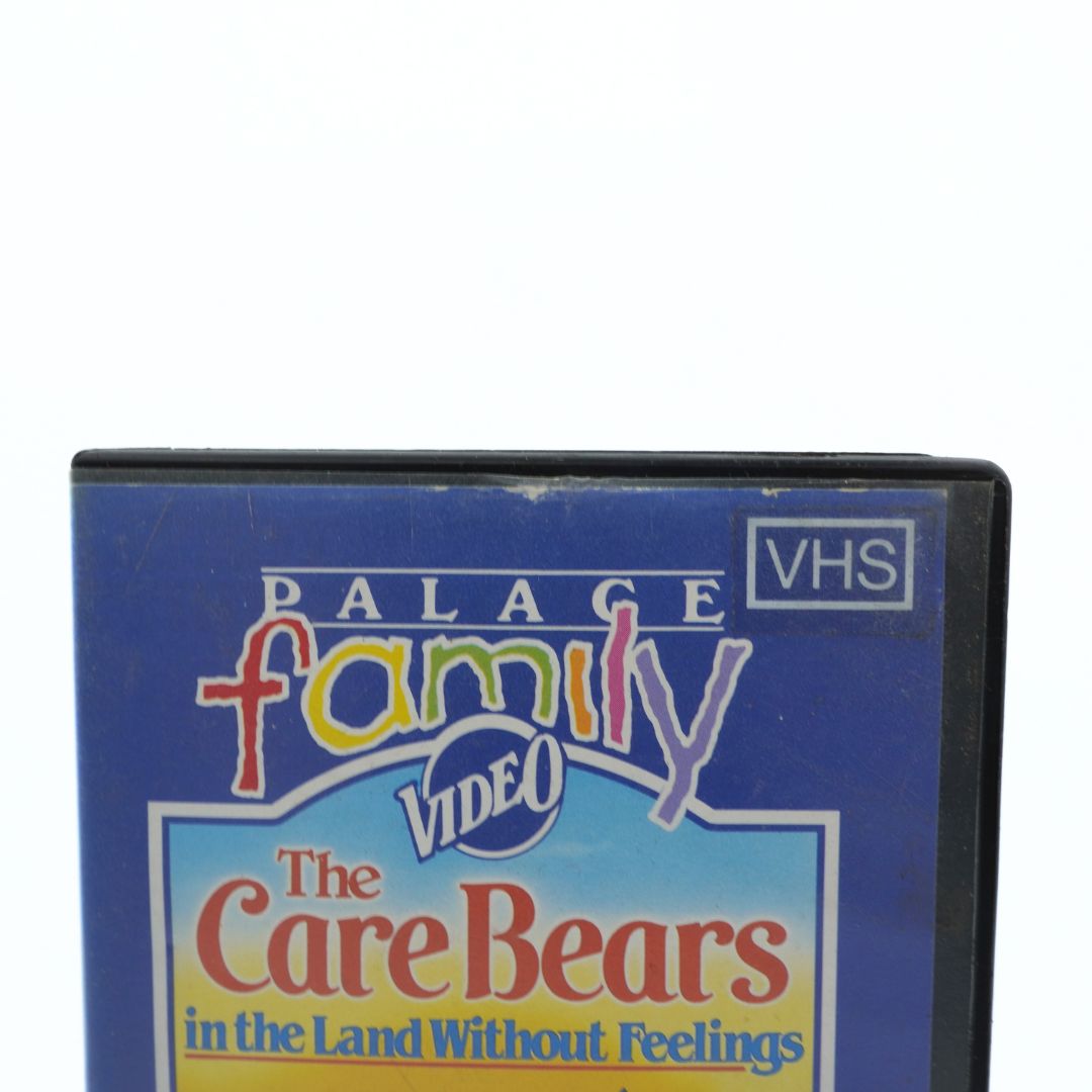 VHS tape cover for 'The Care Bears in the Land Without Feelings' by Palace Family Video on a white background