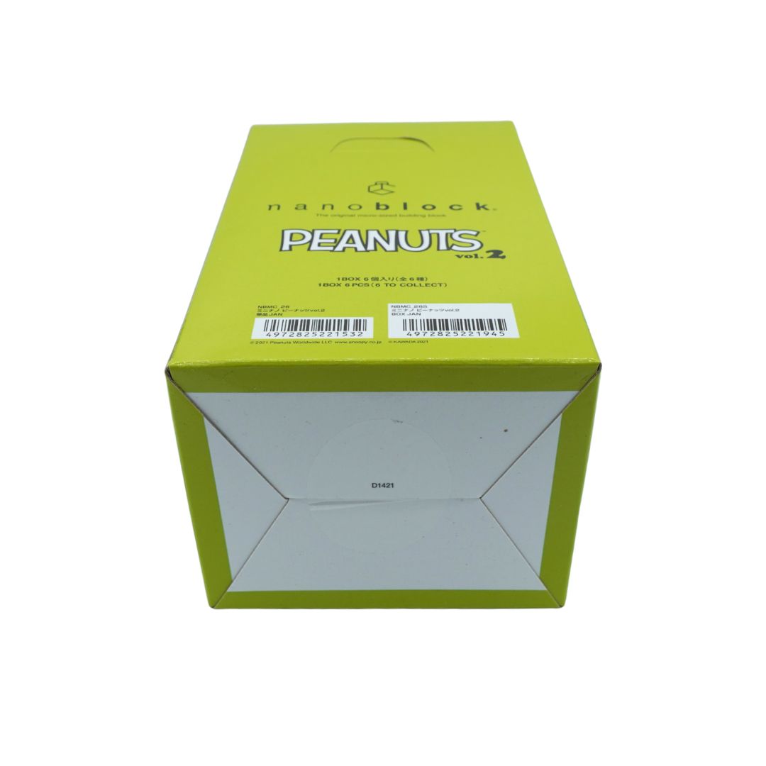 Green box holding the Nanoblocks Peanuts vol. 2 set, photographed on a white background
