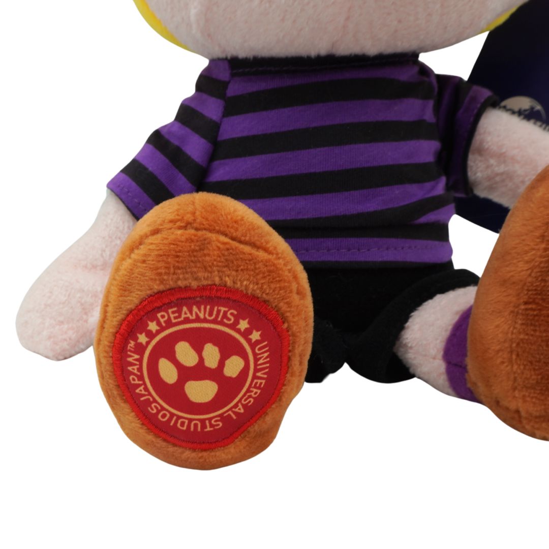 Plush toy with a paw print logo on a white background