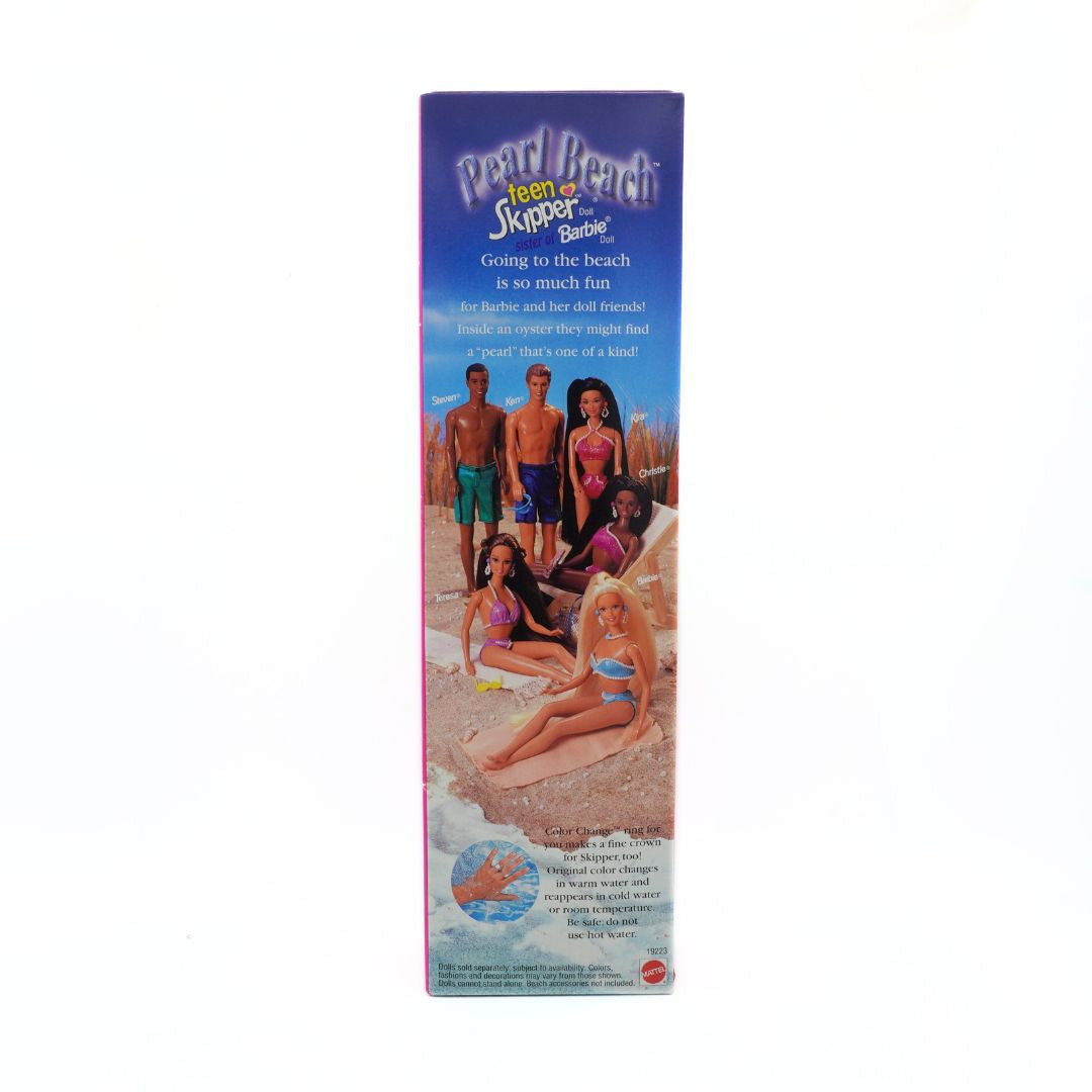 Vintage packaging of Pearl Beach Barbie with dolls on a beach scene