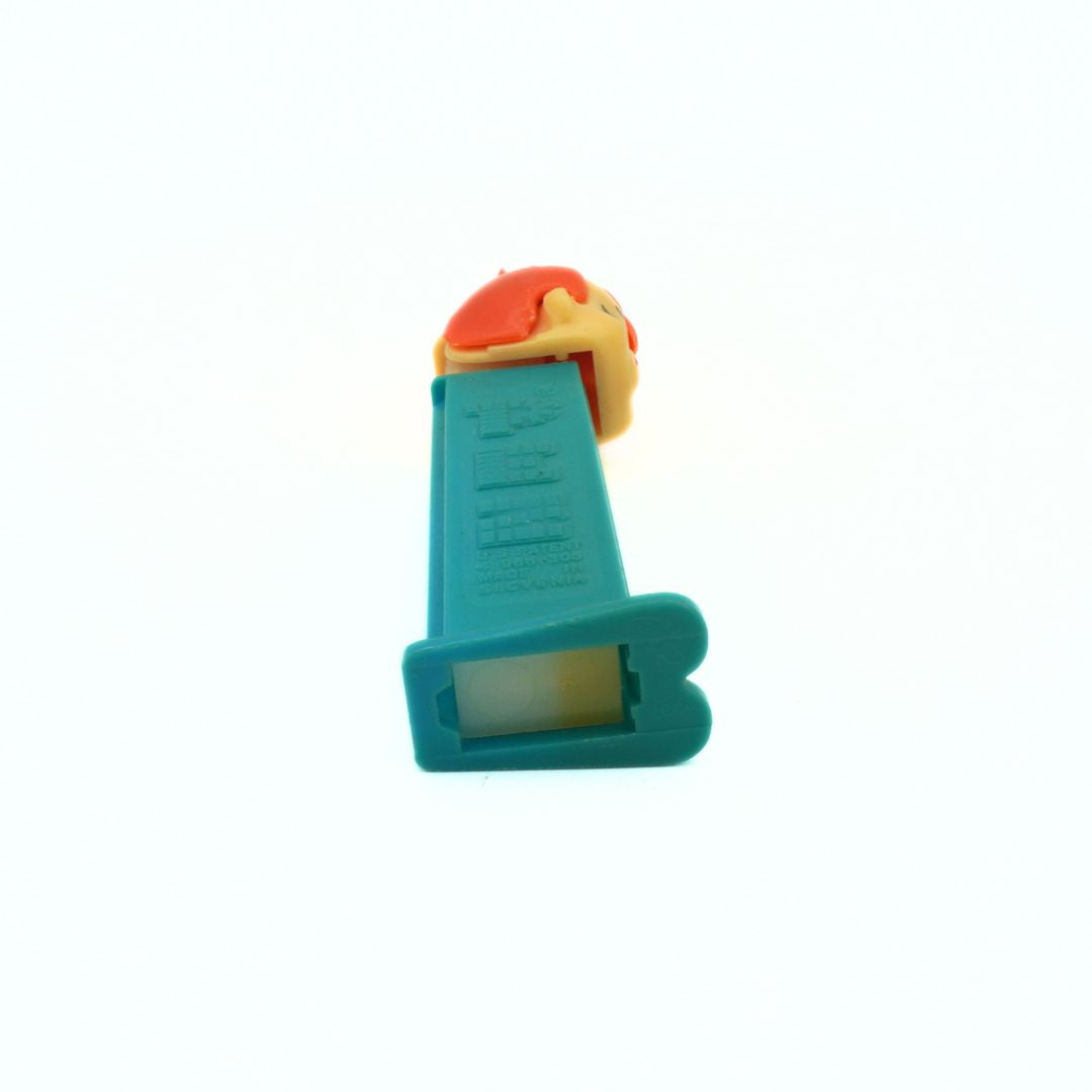 Underside of a vintage Pebbles Pez Dispenser showing some minor discolouration