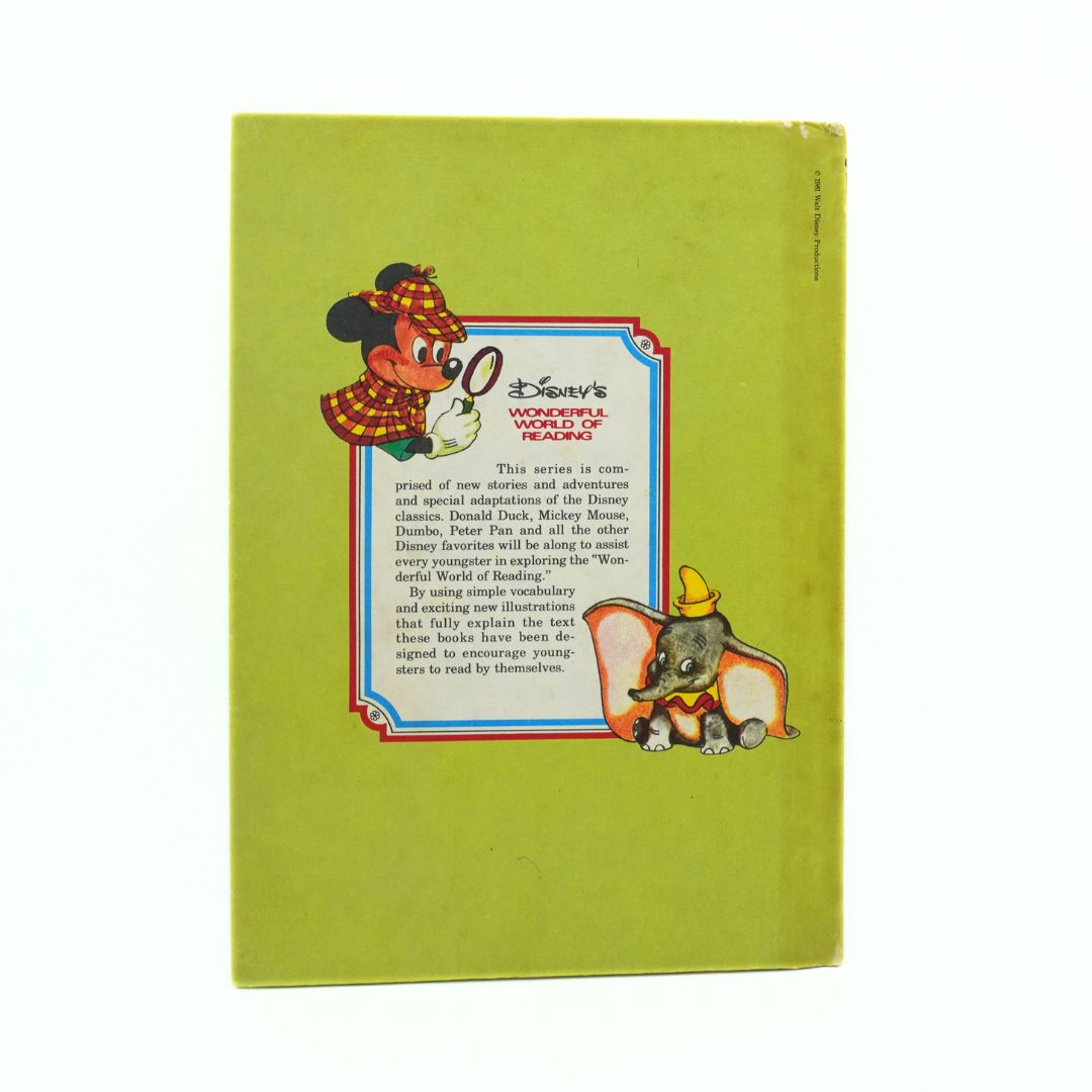 Vintage Disney book with character illustrations on a green background