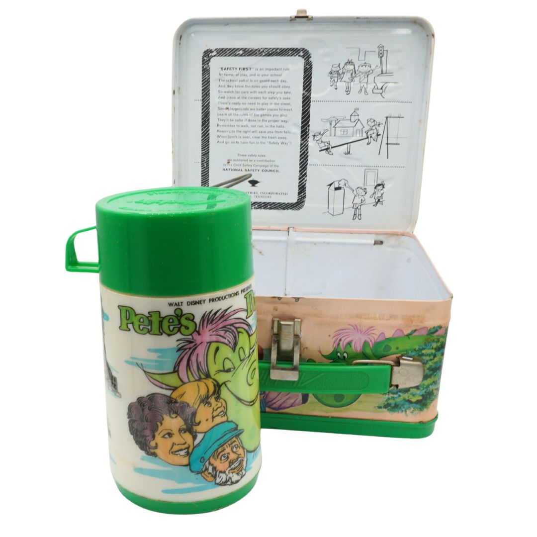 Vintage lunchbox and thermos with cartoon characters on a white background