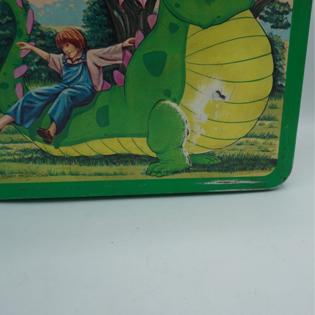 Vintage children's book illustration of a boy riding a green dinosaur in a forest.