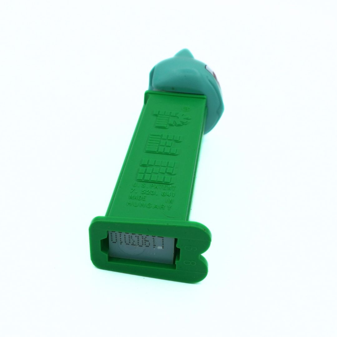 Green plastic toy on a white background