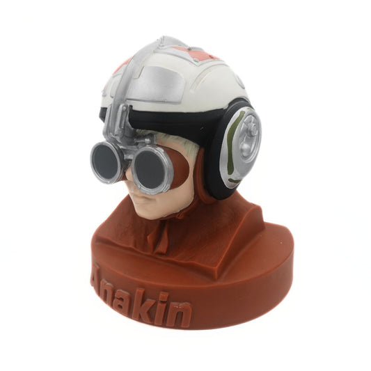 A bust of young Anakin from Star Wars as a hard plastic money box
