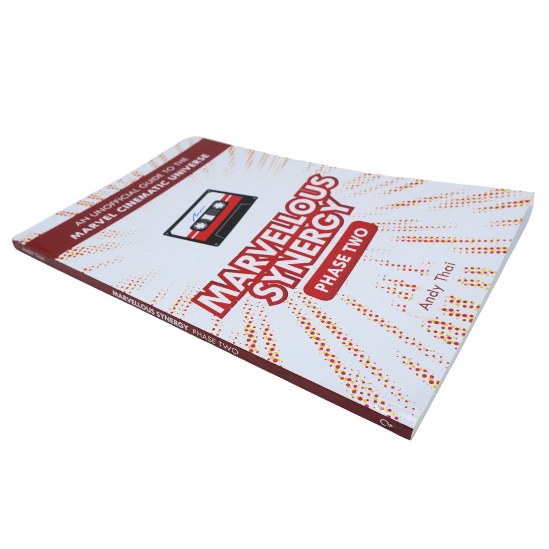 Marvelous Sinergy Phase Two book by Andy Puel, featuring a white cover with red and orange text and graphics, shown at an angle on a white background.