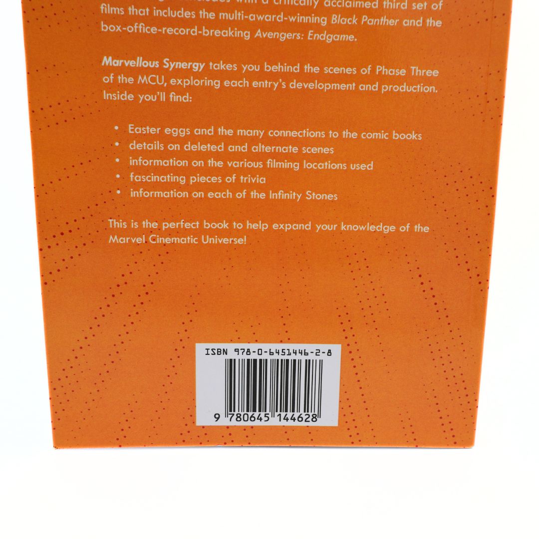The back cover of a book, featuring a textured orange background with black text and a white barcode label near the bottom.