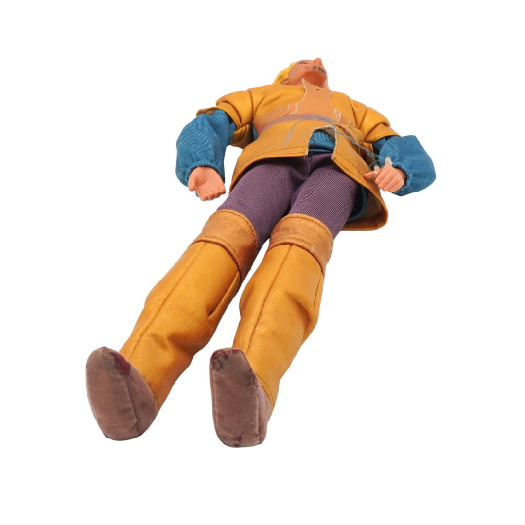 Action figure in yellow coat and brown pants on a white background