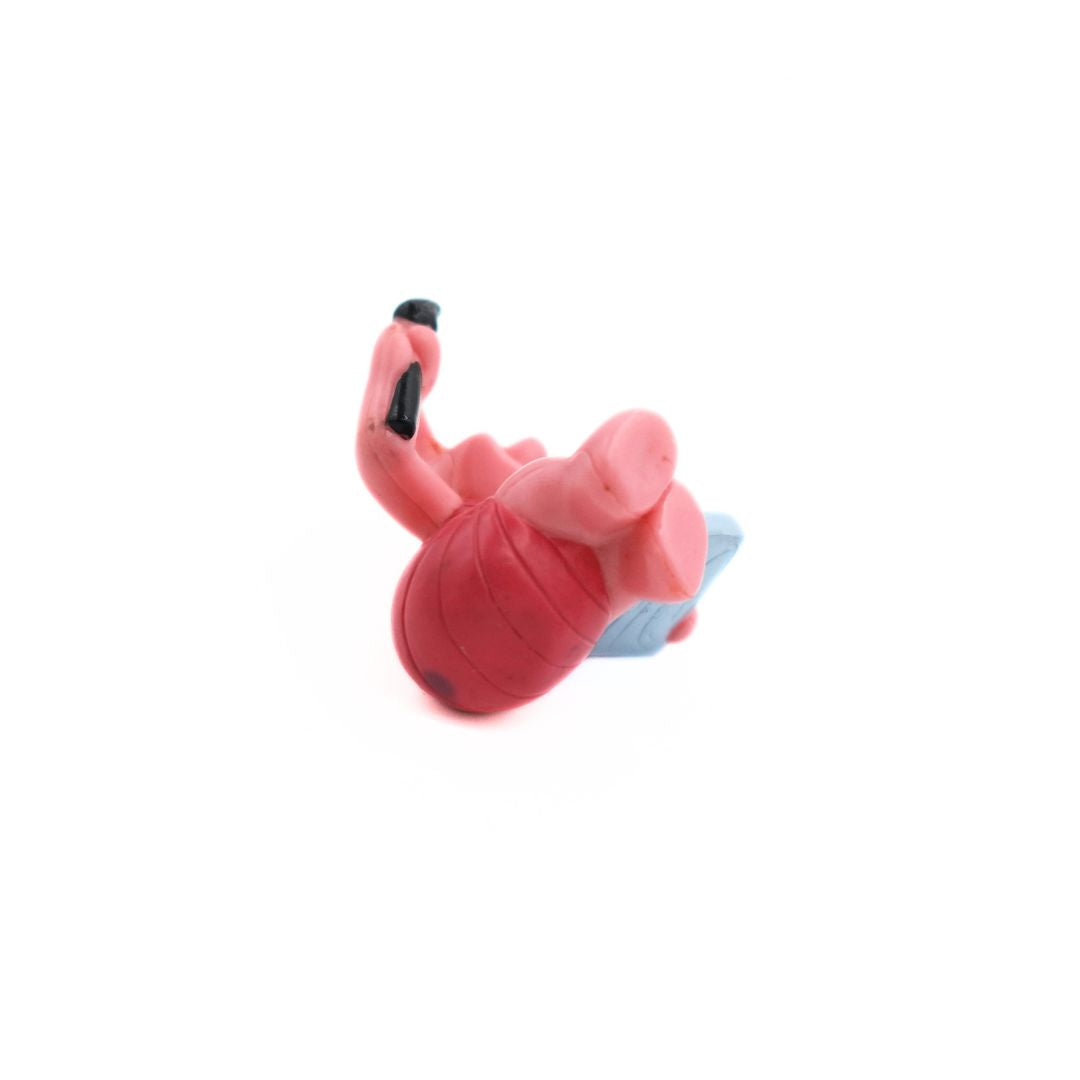 Underside of a mini Piglet figurine with a pink and black colourway