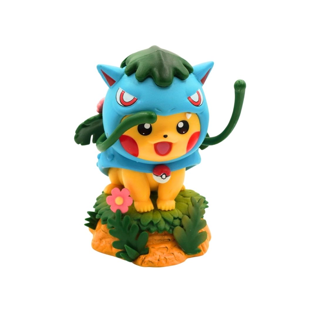 A collectible figurine of Pikachu dressed in a blue and green leaf costume, standing on a small green and orange leafy base against a plain white background.