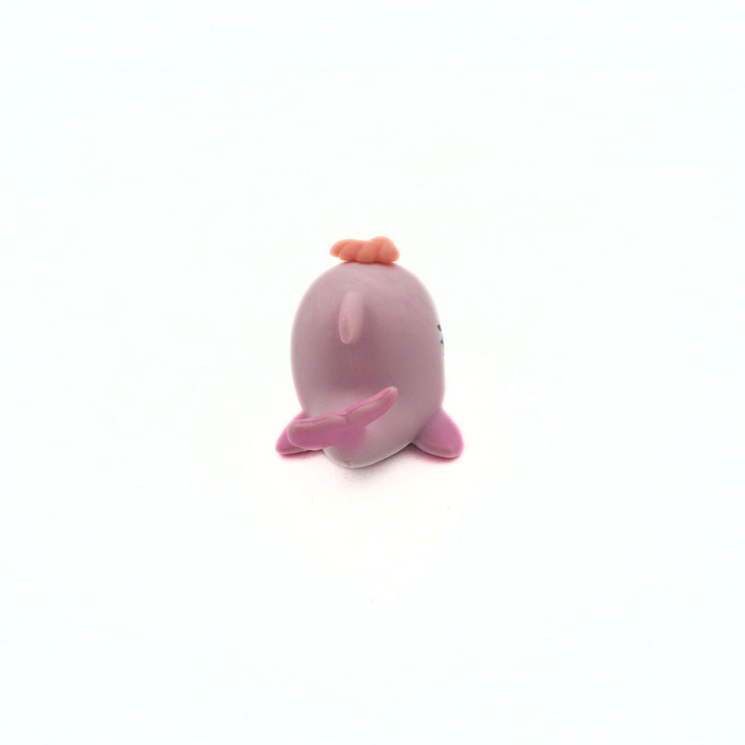 Pink dolphin toy on a white background