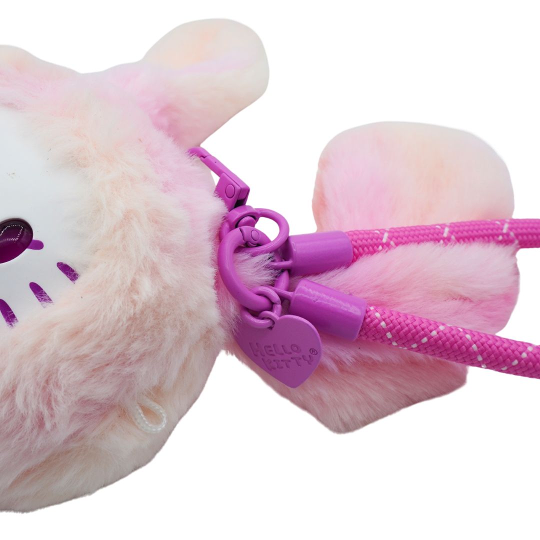Closeup of a pink and purple Hello Kitty bunny plush with a loop to attach it to your bag