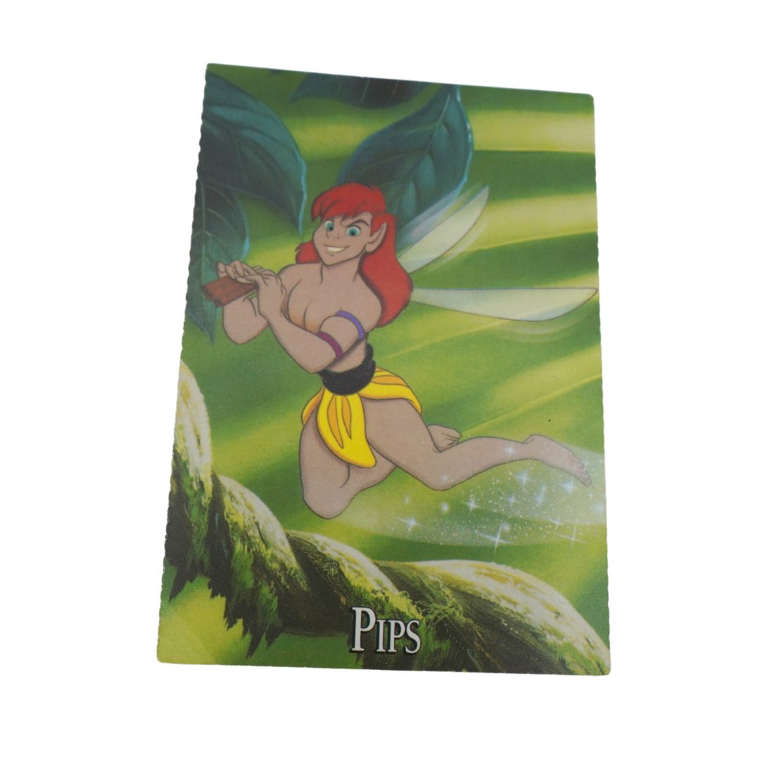 A collectible fantasy trading card featuring the character Pips, a red-haired fairy with green wings and a yellow skirt, set against a green leafy background. The card is shown at an angle on a plain white background.