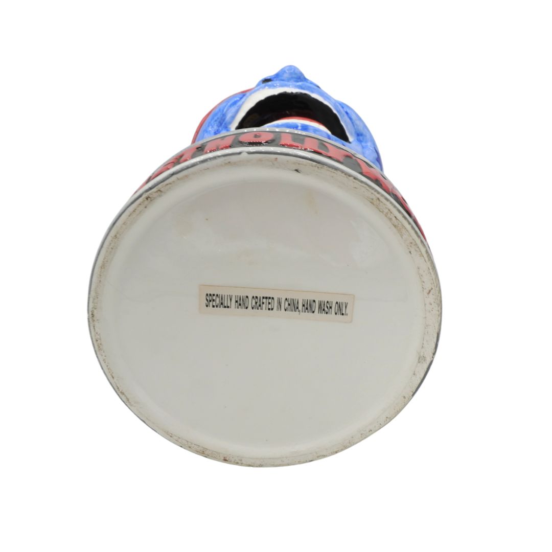Bottom view of a ceramic vase with text on a white background