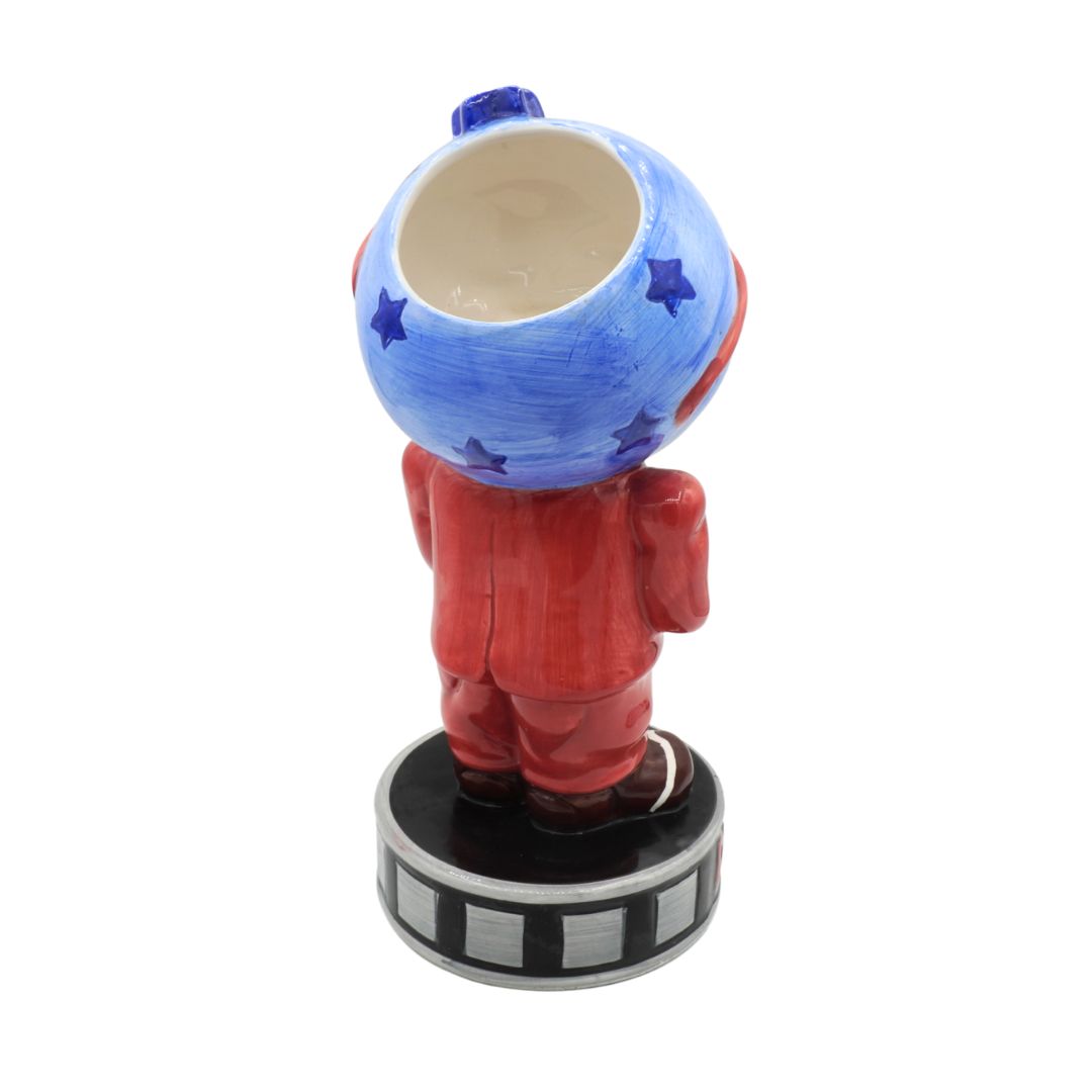 Colorful figurine with a blue helmet and red outfit on a white background
